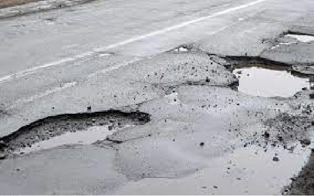 Skandanagar Residents Protest Poor Road Conditions with Sarcastic Banners - News Karnataka