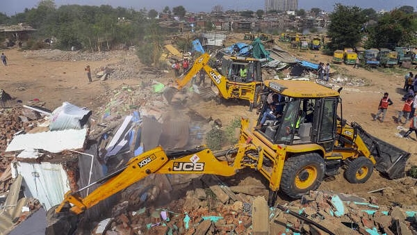 Bulldozers flatten illegal settlements in Ahmedabad after terror alert - News Karnataka