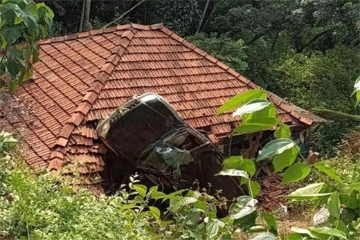 Car falls onto house roof after water bottle gets stuck break - News Karnataka