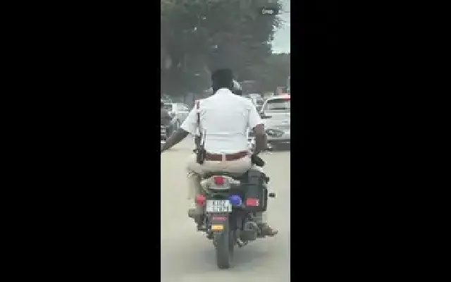 Traffic Cop in Hebbal Fined for Helmet Violation After Photo Goes Viral - News Karnataka