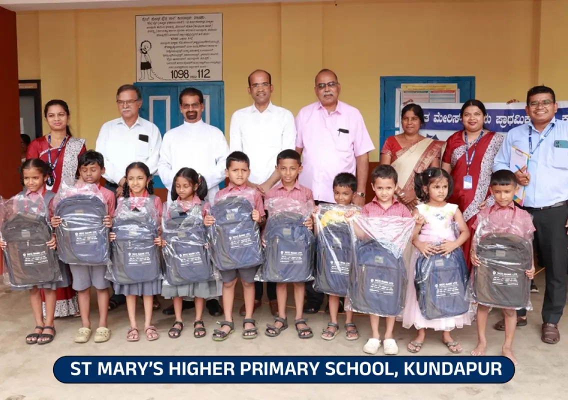 MCC Bank reaches out with compassion through school kits and umbrella donations - News Karnataka