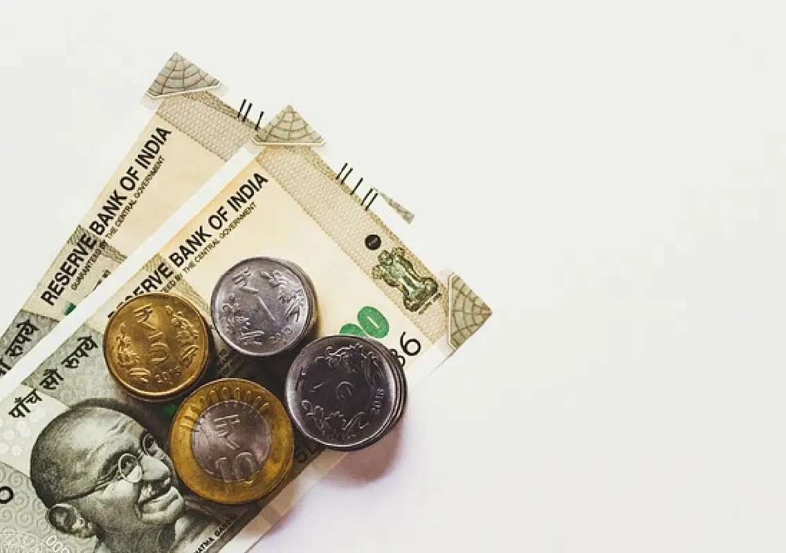 Rupee trades in narrow range near record low as quarter-end flows weigh - News Karnataka