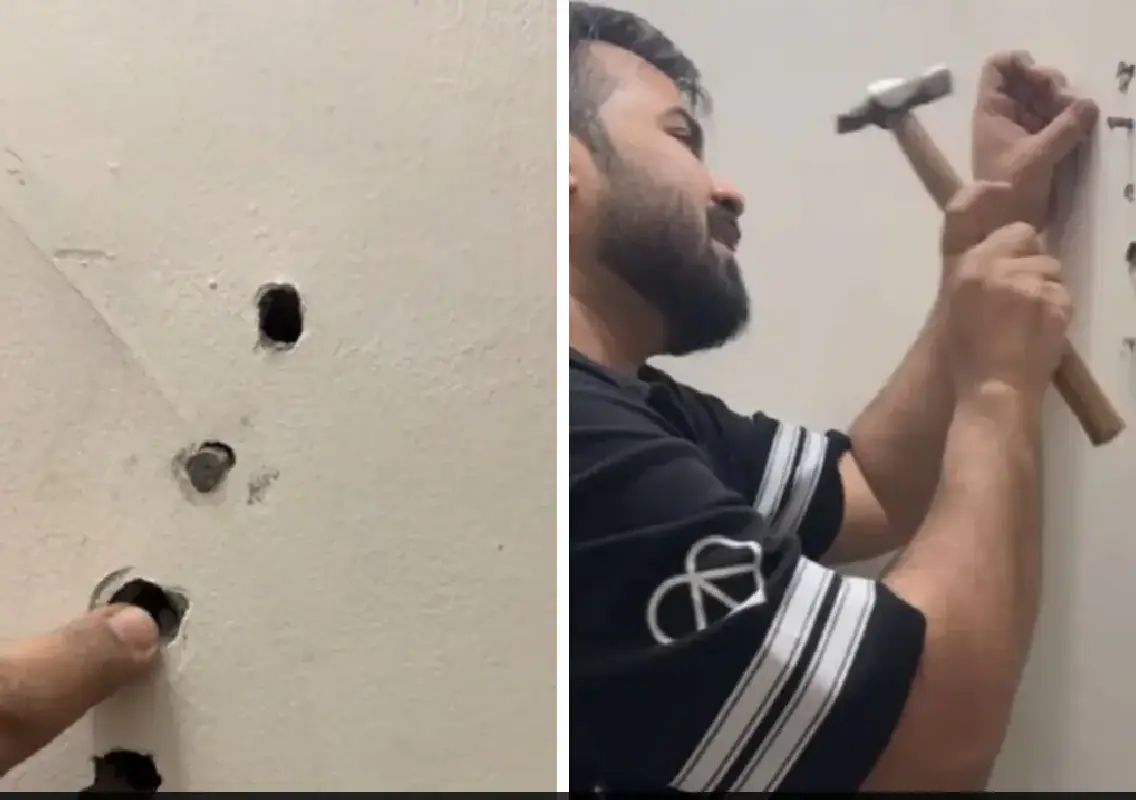 Noida man pokes hole in ₹1.5 crore apartment wall with pencil, video sparks debate on construction quality:WATCH - News Karnataka
