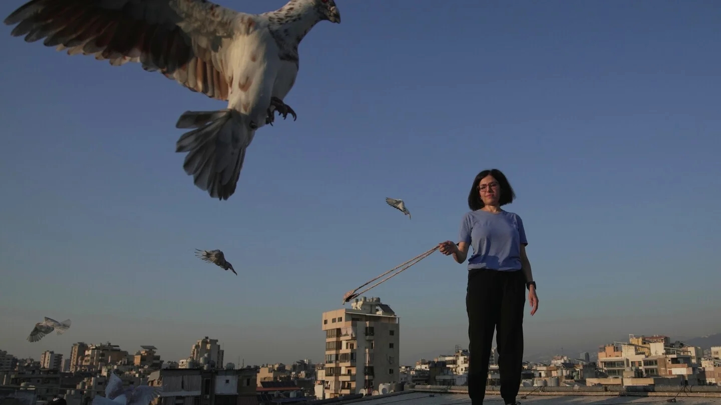 Beirut woman finds peace in pigeons amid city chaos - News Karnataka