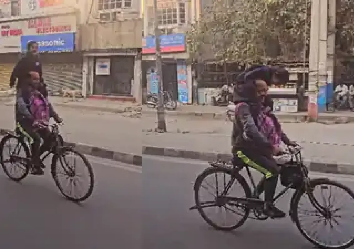 Viral video of father–daughter cycling to school melts hearts online - News Karnataka