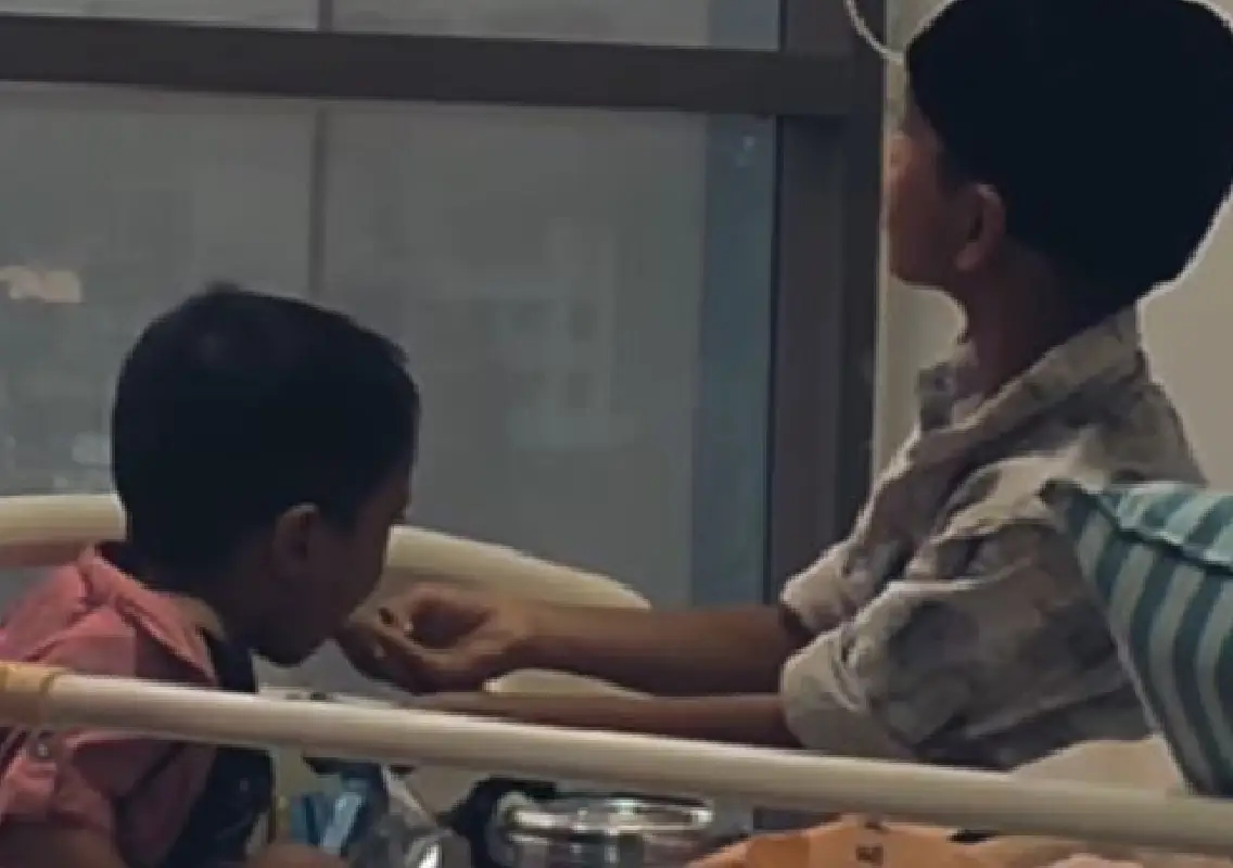 Young boy feeding sick sibling melts hearts online - News Karnataka