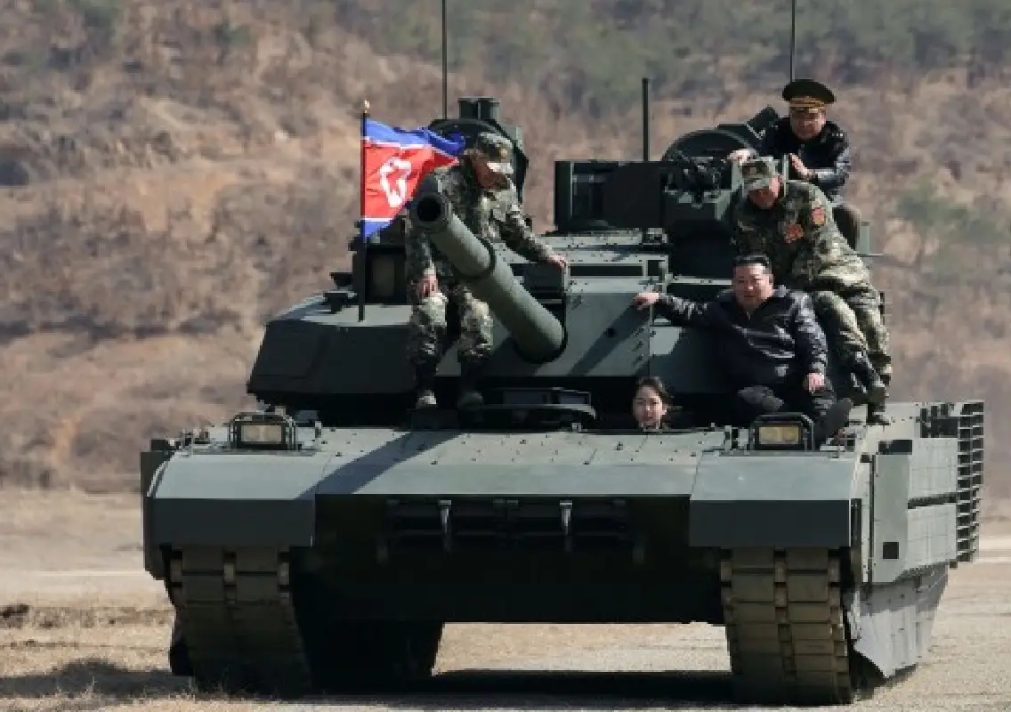 Kim Jong Un rides tank with daughter amid war drills - News Karnataka