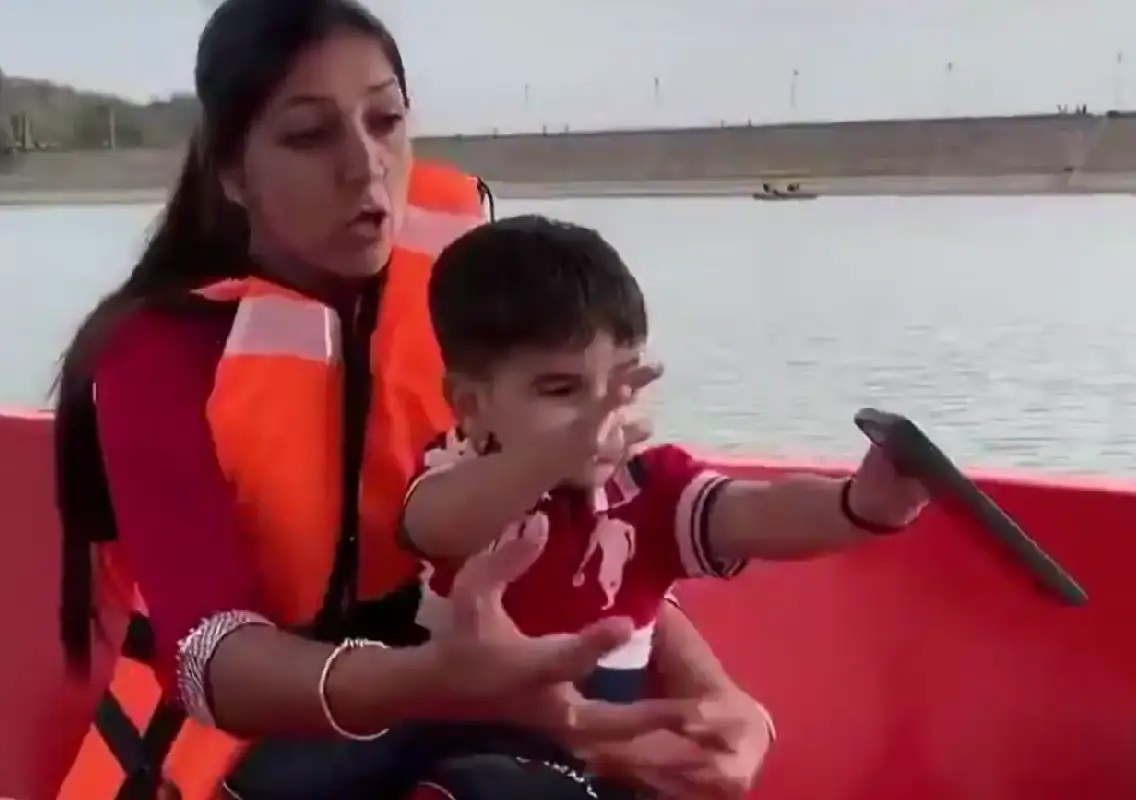 Child tosses mother's iPhone into lake in viral boat video - News Karnataka