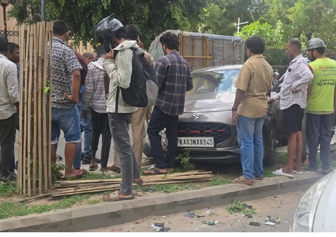 Woman escapes unhurt after car crashes into divider during U-turn - News Karnataka