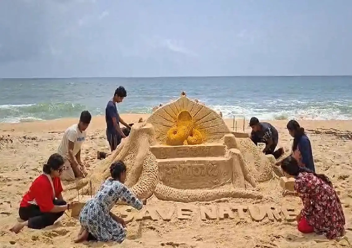 ‘Nagabana’ sand sculpture draws attention at Koteshwar beach - News Karnataka