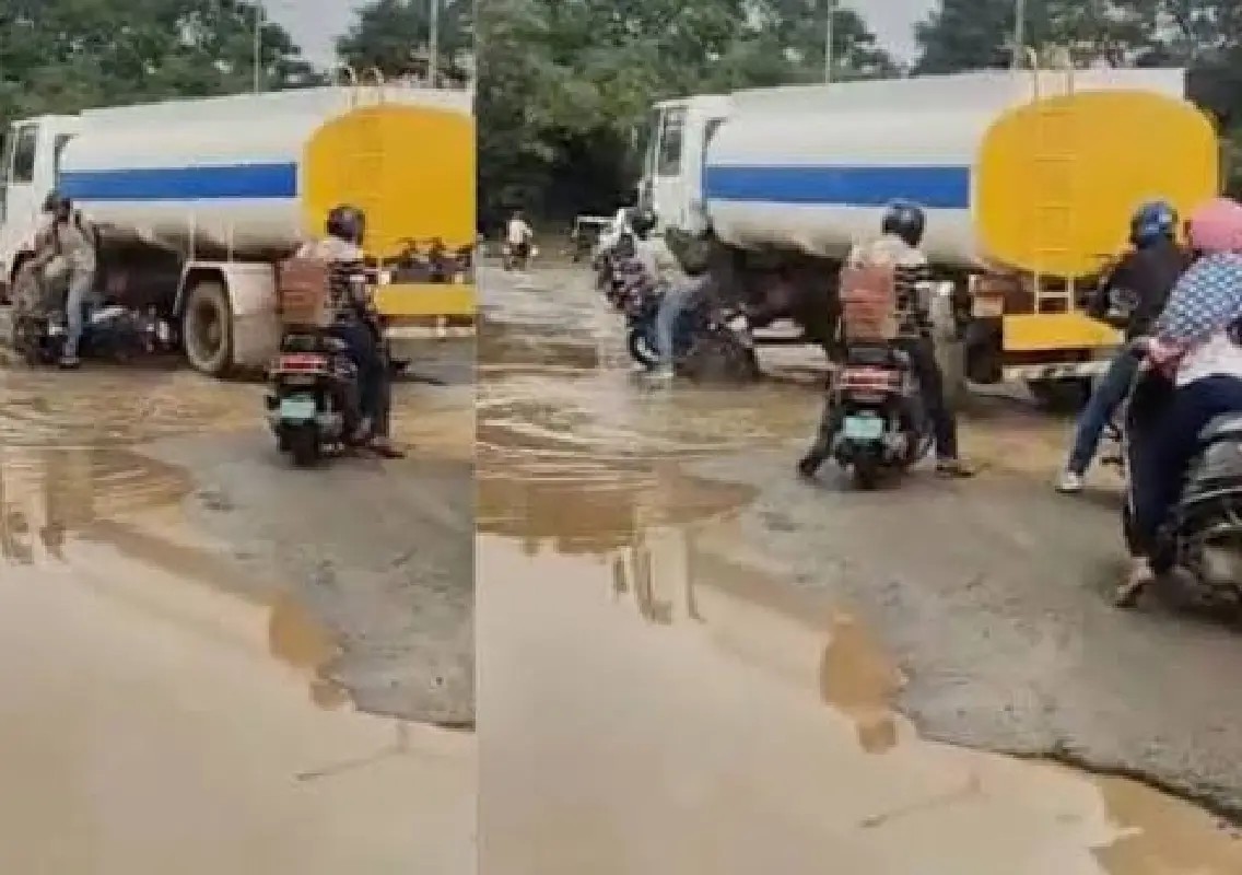 Bengaluru biker has narrow escape after hitting water-filled pothole - News Karnataka