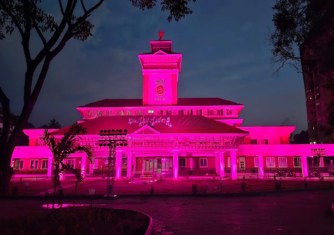 DK DC office illuminated pink to mark three years of Gruha Lakshmi - News Karnataka