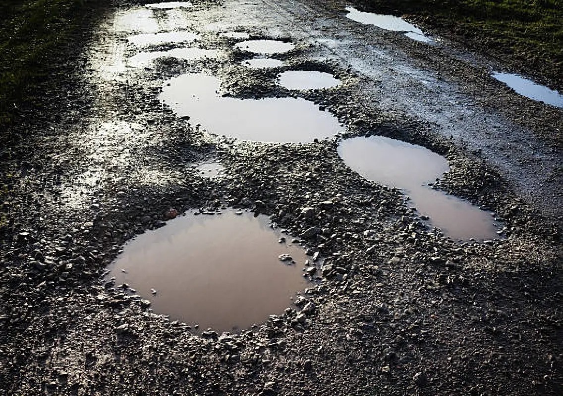 Kulur Bridge highway potholes trigger safety and traffic concerns - News Karnataka
