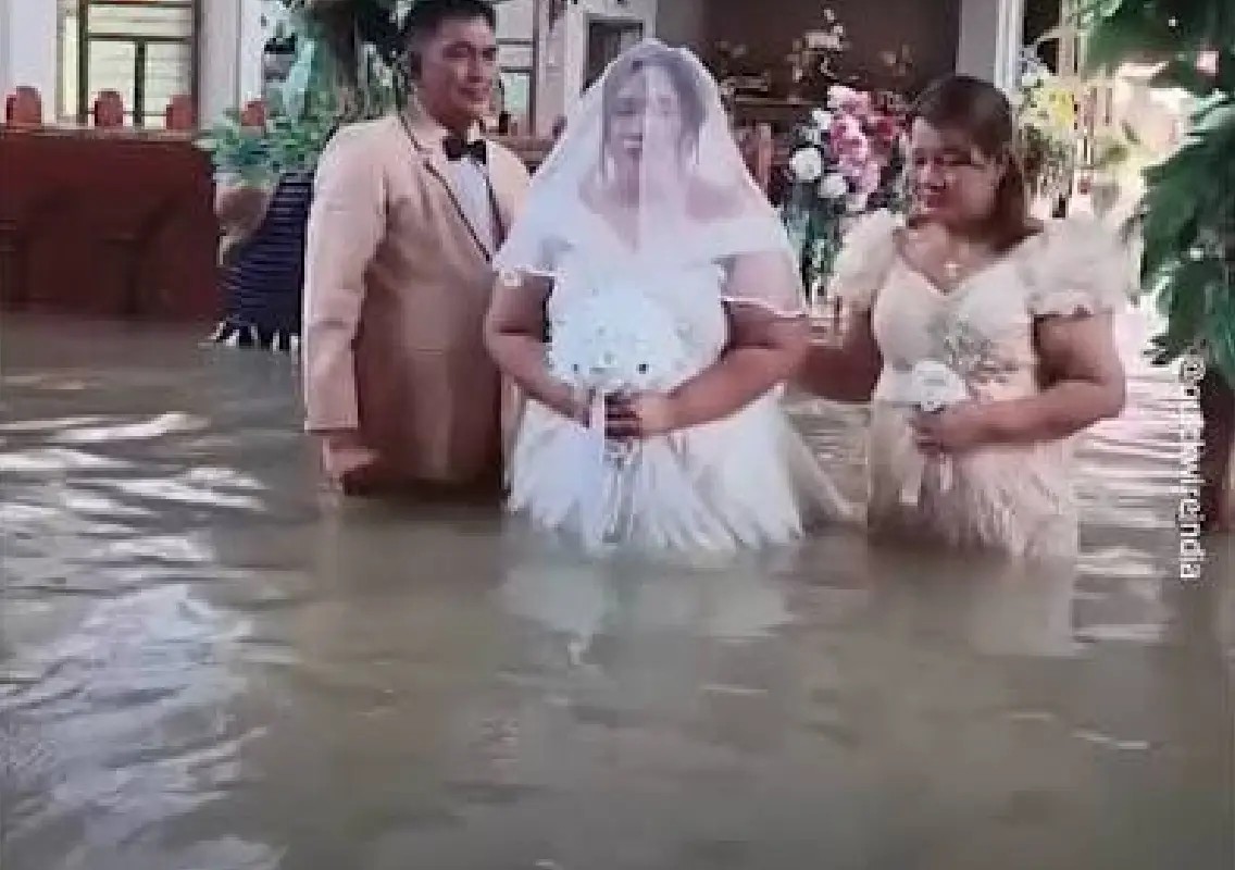 Love finds a way as couple weds in a flooded church - News Karnataka
