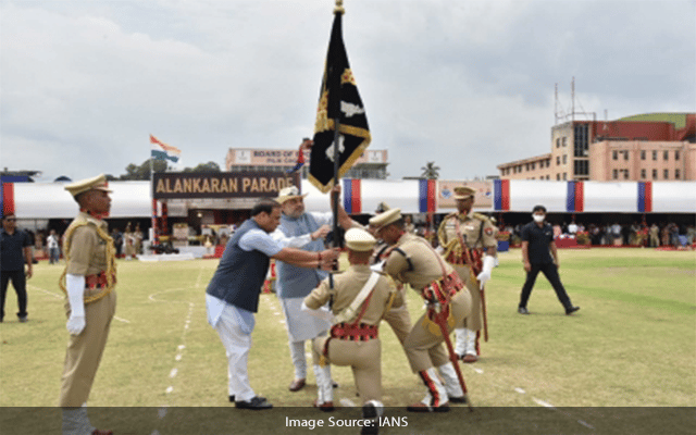 Home Minister presents Presidents Colour to Assam Police