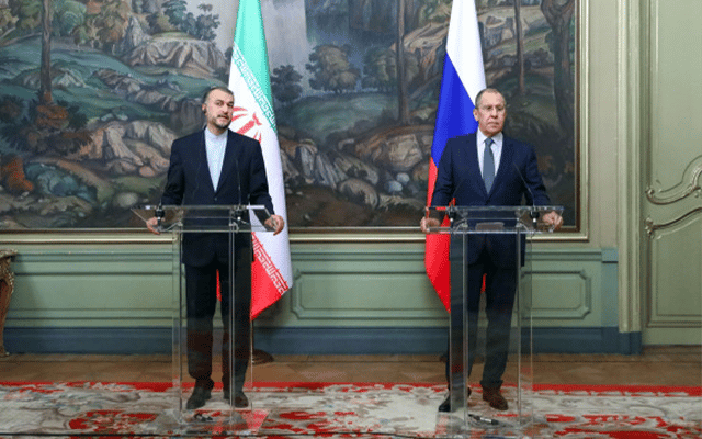 Russian Foreign Minister Sergei Lavrov (R) and Iranian Foreign Minister Hossein Amir