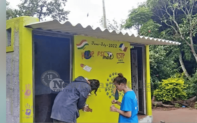 French students paint walls of toilet