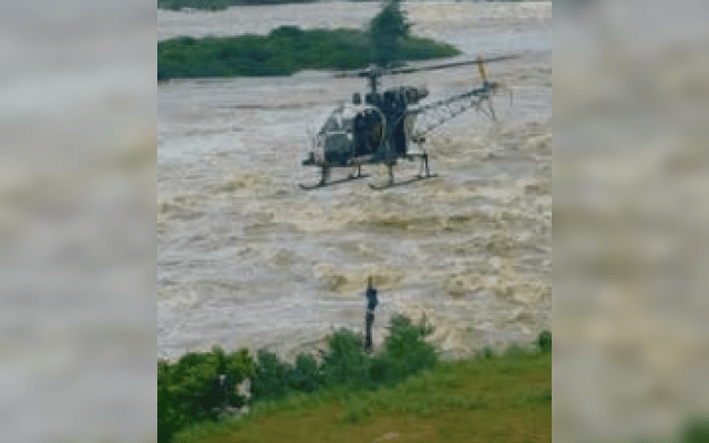 farmers trapped in middle of river