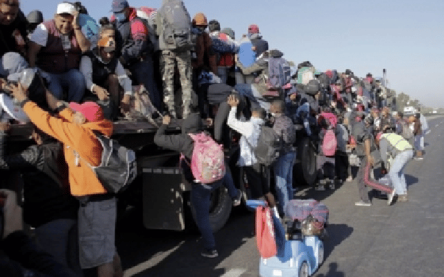 migrants cross US-Mexico border