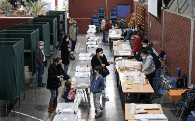 Voters register to cast their ballots at a voting center in Santiago, Chile